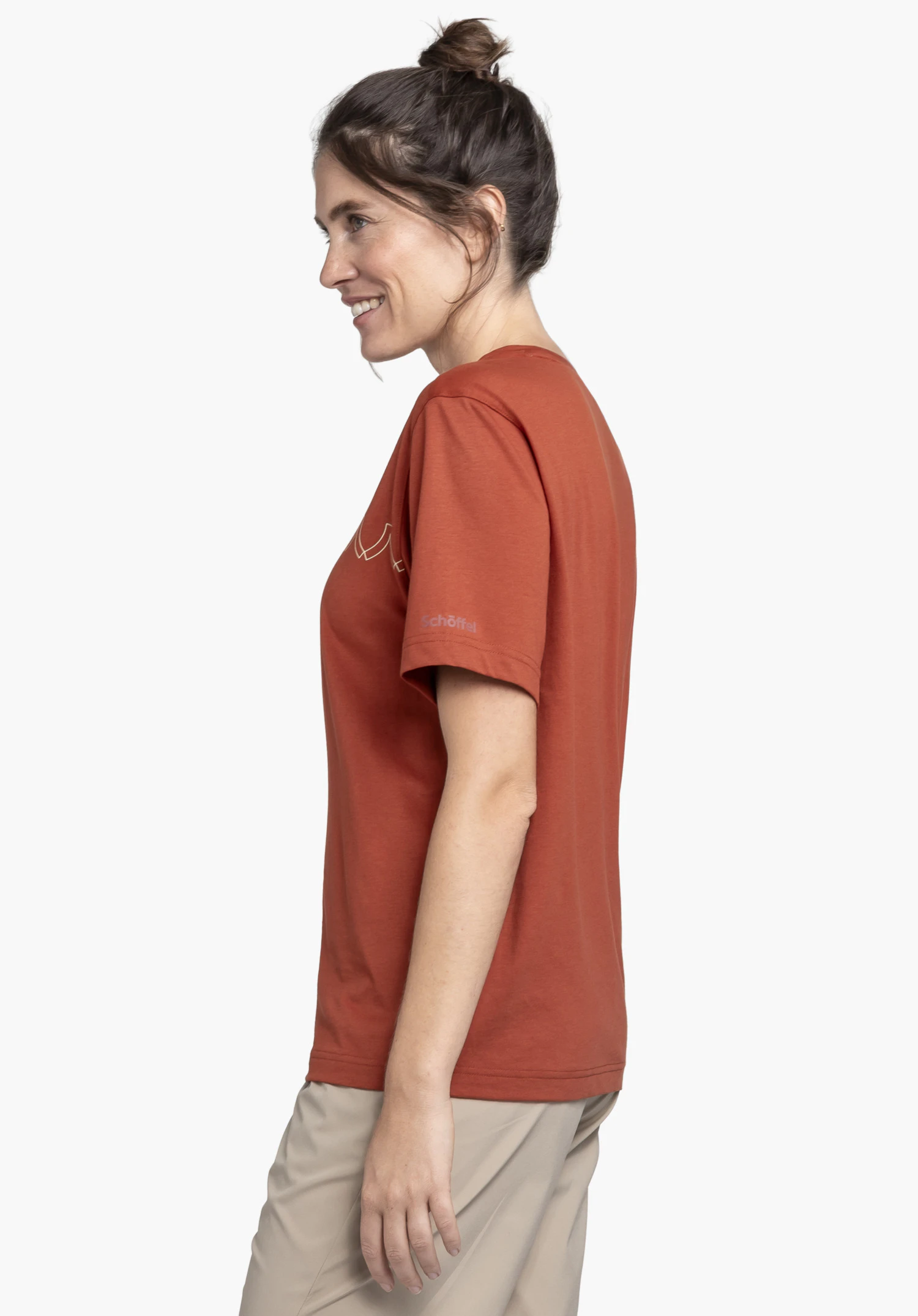 T Shirt Style Elmori WMN in red, shown in a side profile view against a neutral background. The model is wearing the t-shirt, highlighting the subtle Schöffel logo on the sleeve.