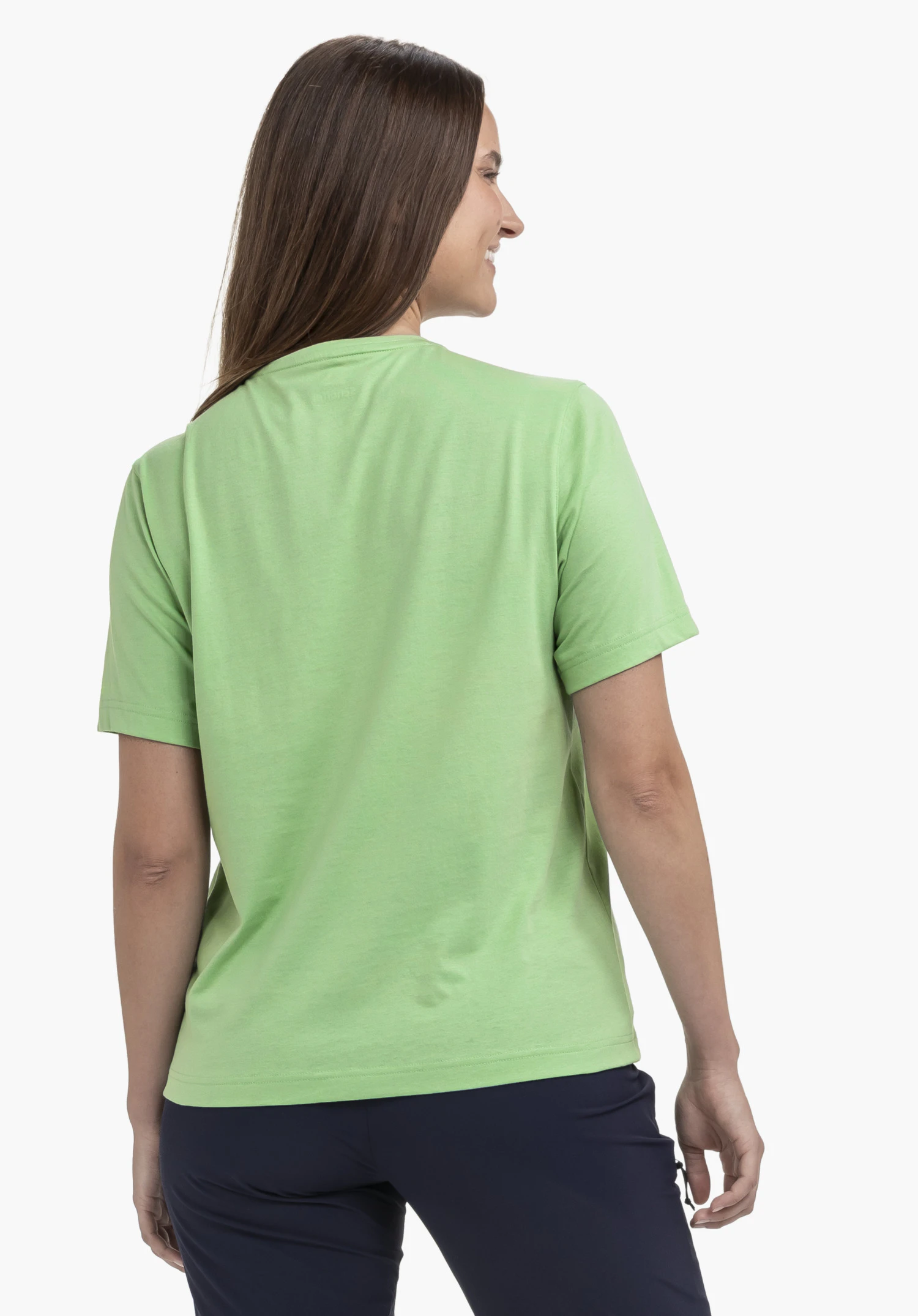 T Shirt Style Elmori WMN in the colour green, worn by a model in a back view. The model is standing slightly turned to the side against a neutral background.