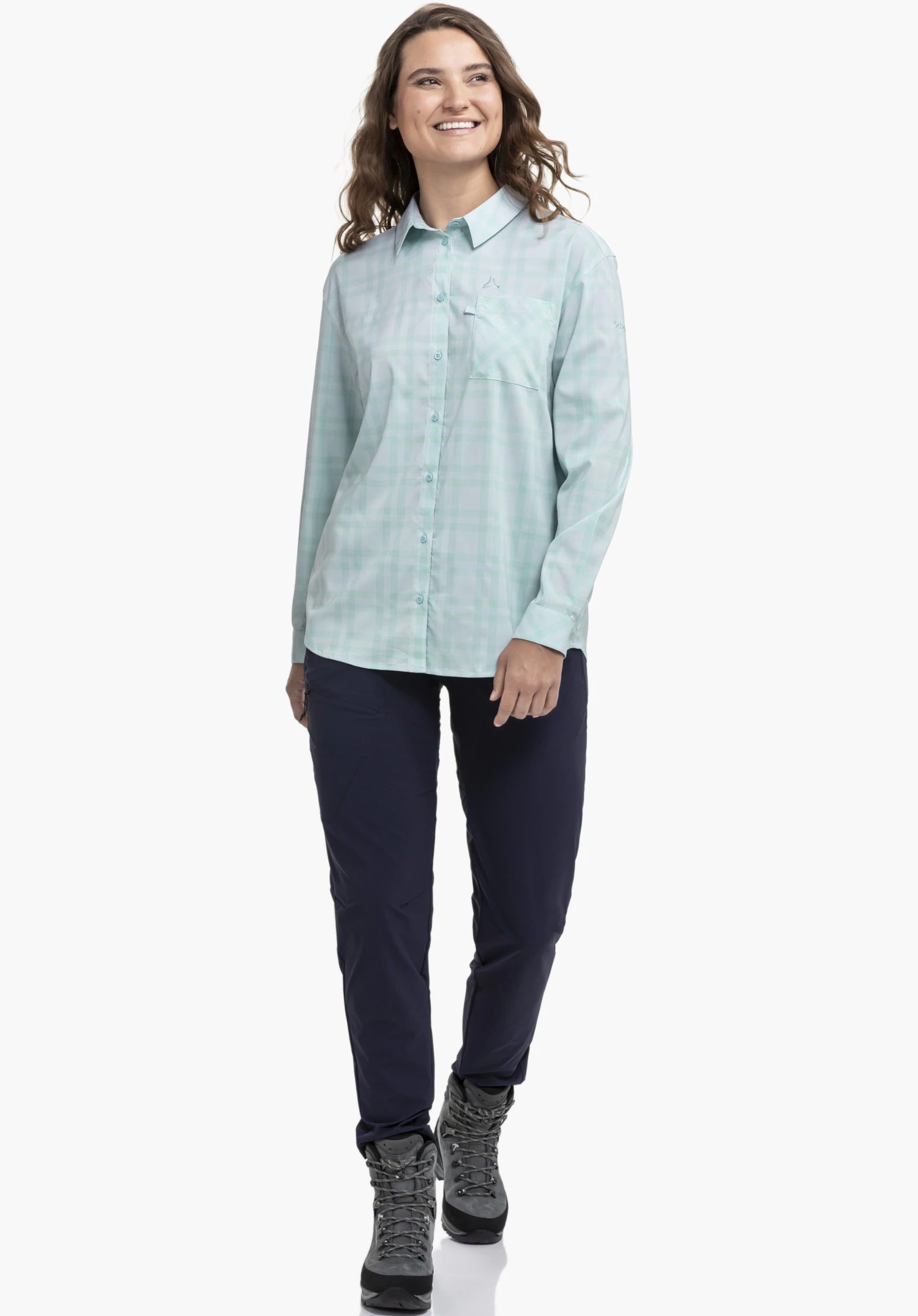 Blouse Style Fraris WMN, focus on the blue checked fabric, the front button placket and the embroidered Schöffel-Logo above the breast pocket, close-up against a white/neutral background.