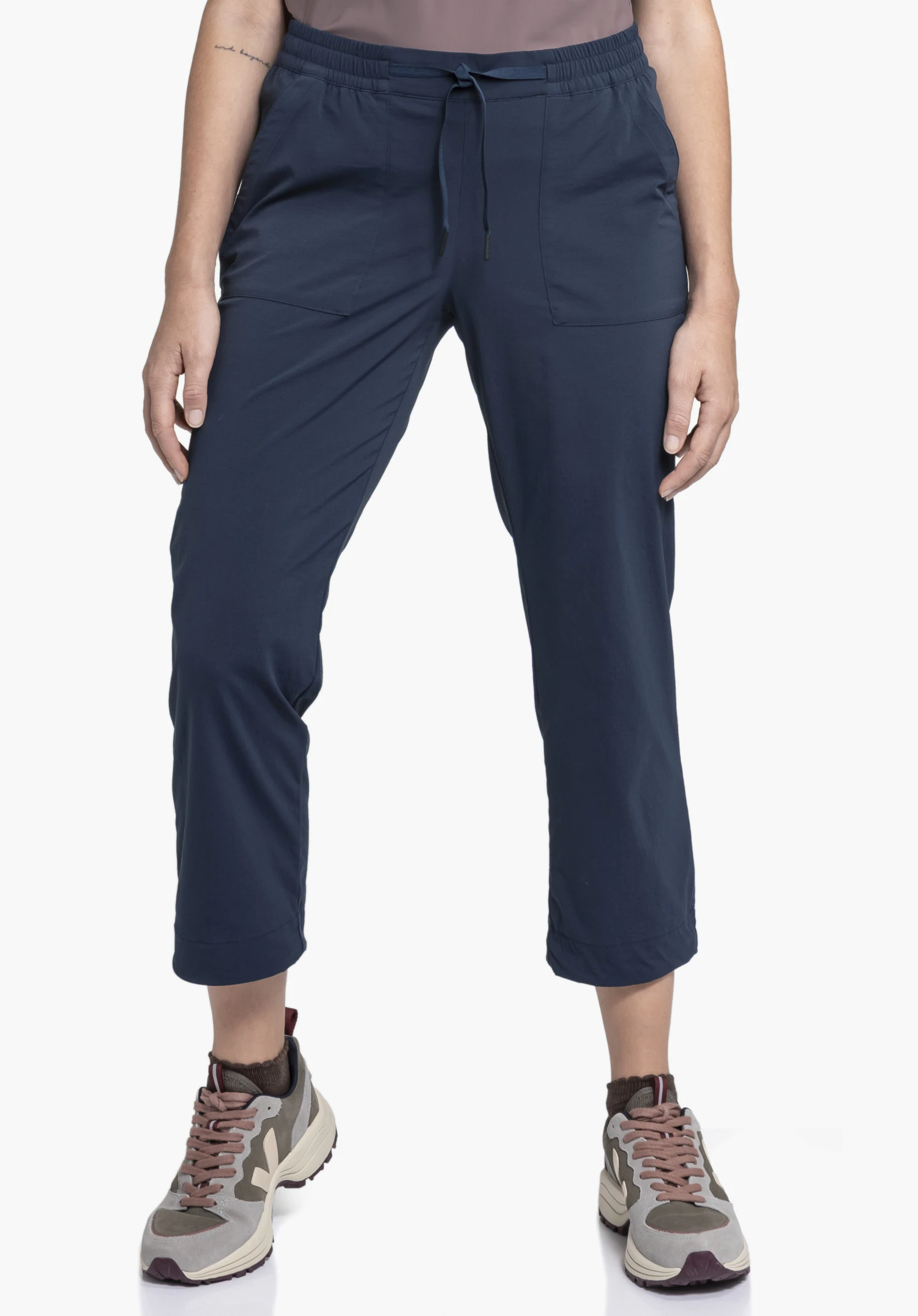 Pants Rangun L in blue, worn by a model standing frontally to the camera, presented against a neutral background.