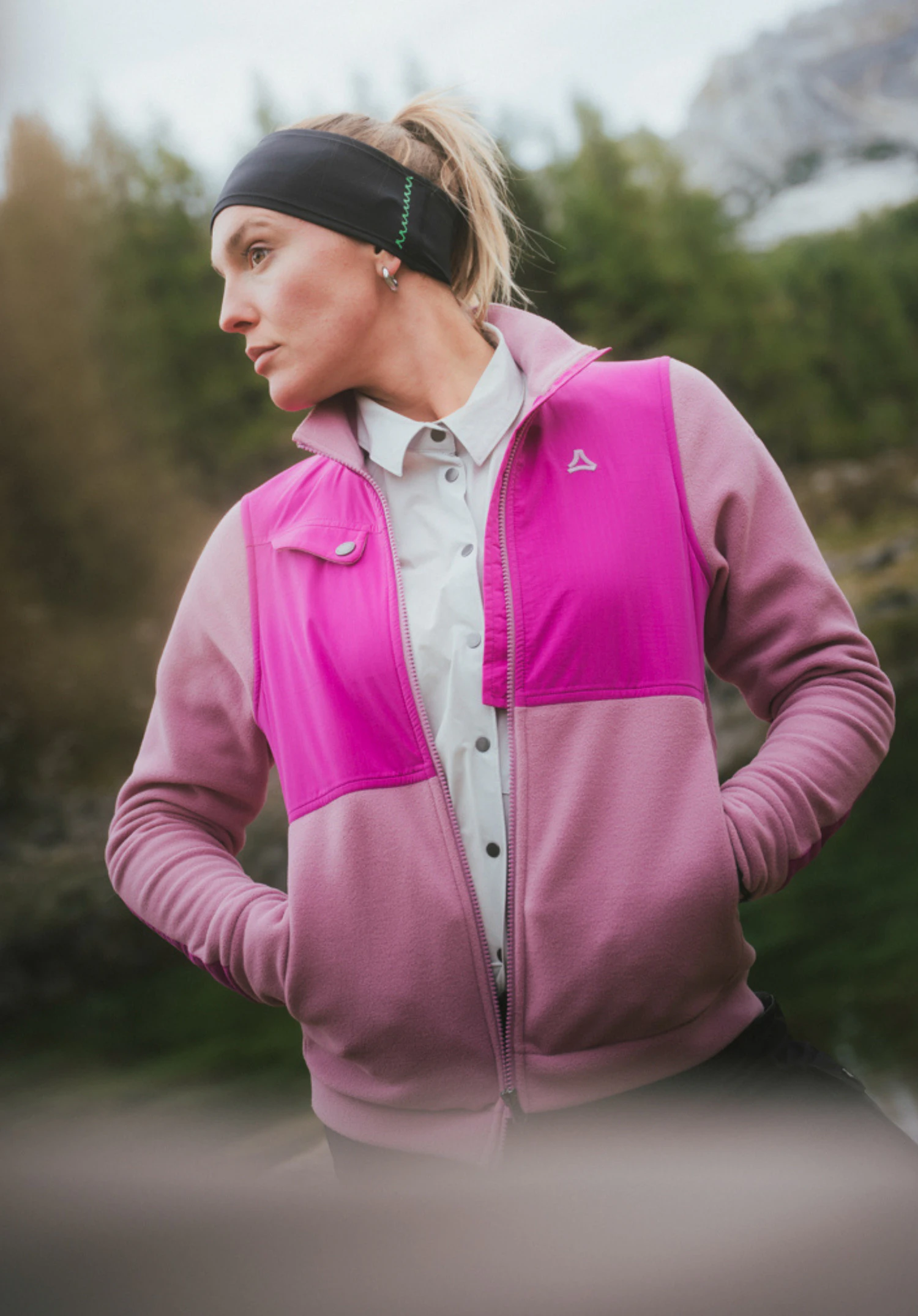 Fleece Jk Style Maghera WMN in pink, worn by a model. The model stands with her hands in the side pockets, looking to the side, showcasing the jacket with the visible Schöffel-Logo on the left chest. Photographed against a neutral background.