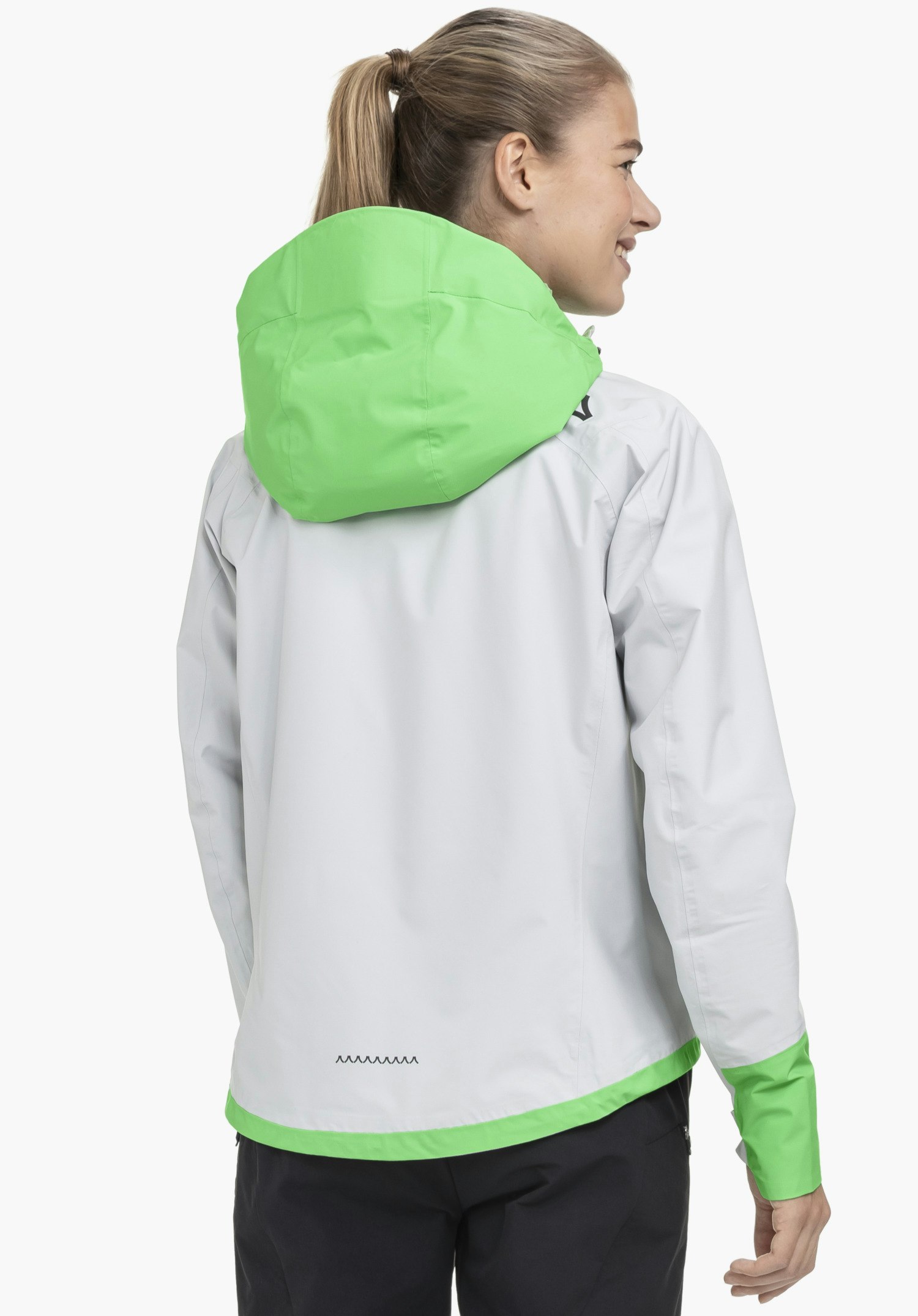 2.5L Jacket Style Tajiva WMN in grey shown from the back on a model against a neutral background, featuring the green hood and the Schöffel logo on the shoulder.