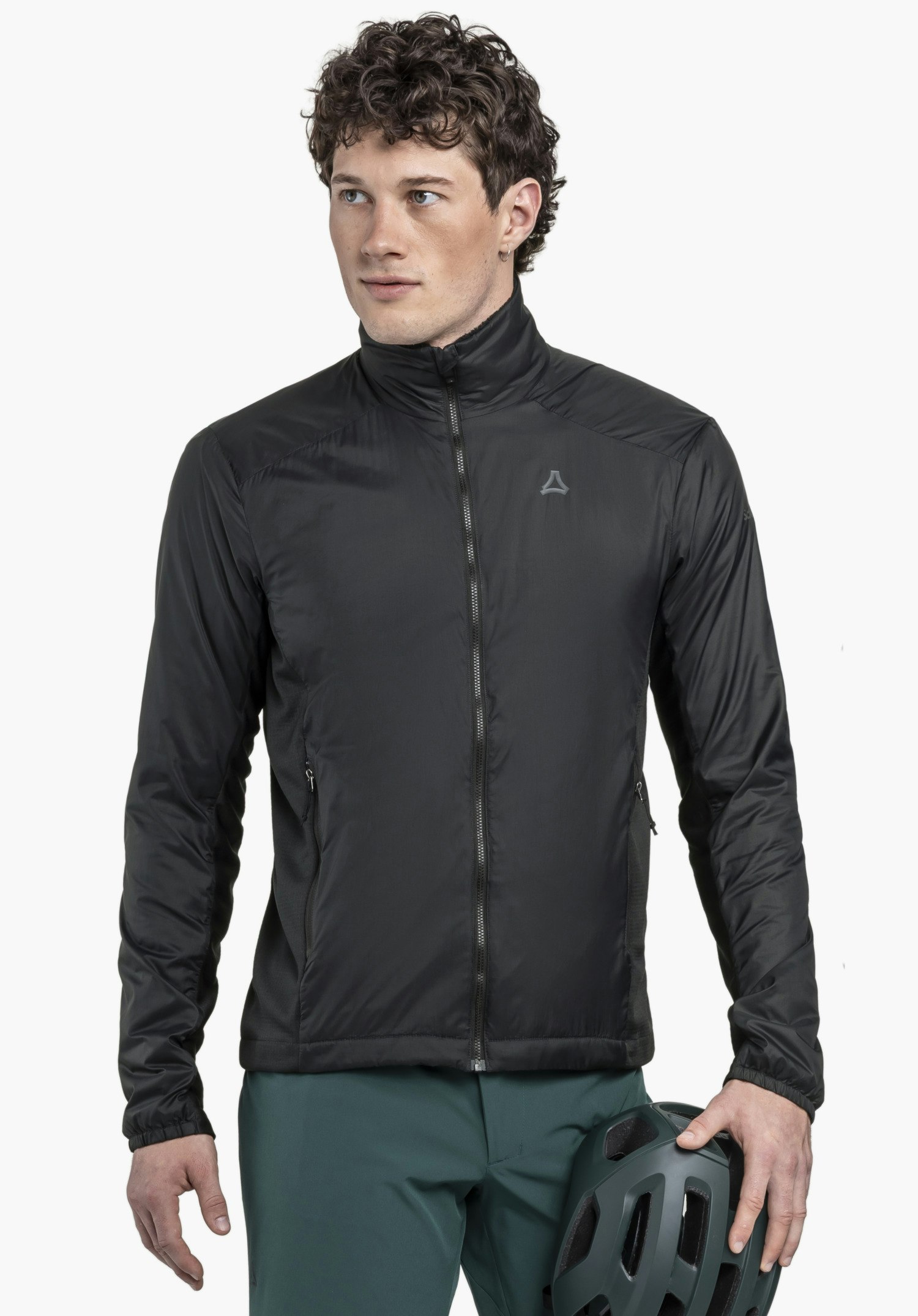 Ins Jacket Style Samaia MEN worn by a model standing frontally and looking to the side. The black jacket is zipped up and features the Schöffel logo on the left chest, while the model holds a helmet, presented against a neutral background.