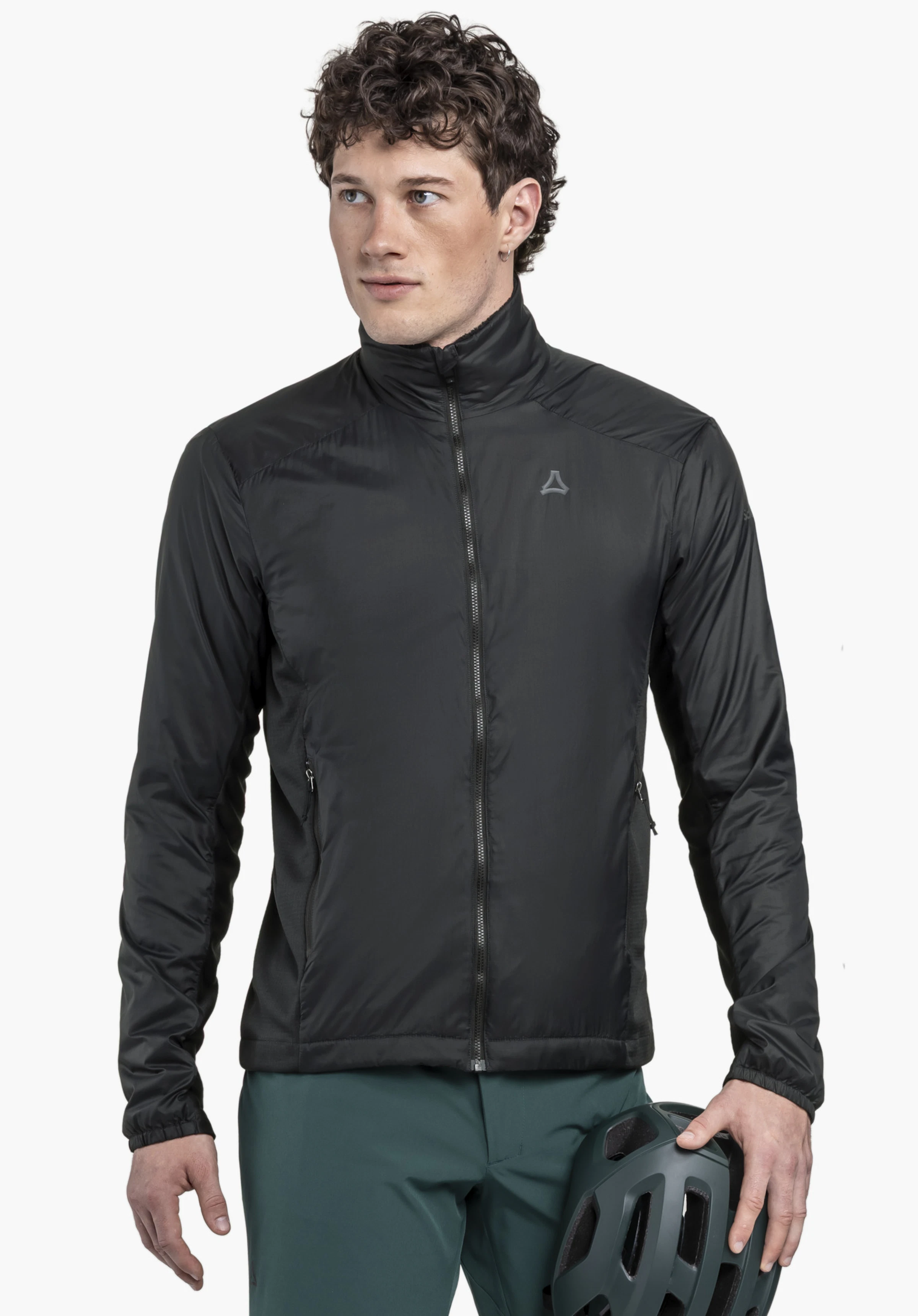 Ins Jacket Style Samaia MEN worn by a model standing frontally and looking to the side. The black jacket is zipped up and features the Schöffel logo on the left chest, while the model holds a helmet, presented against a neutral background.