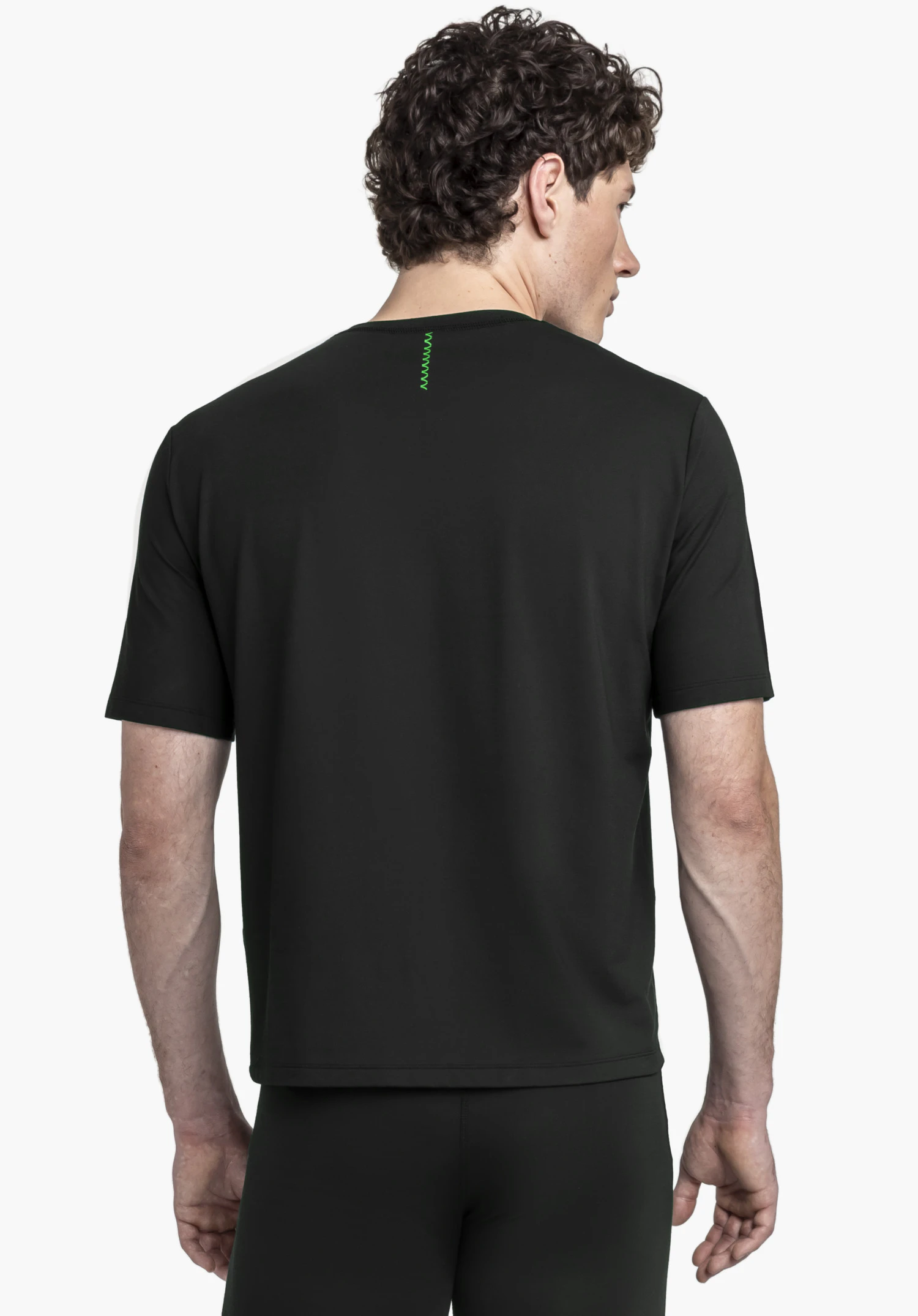 T Shirt Style Mafadi MEN in black shown from the back with a green neck detail against a neutral background.