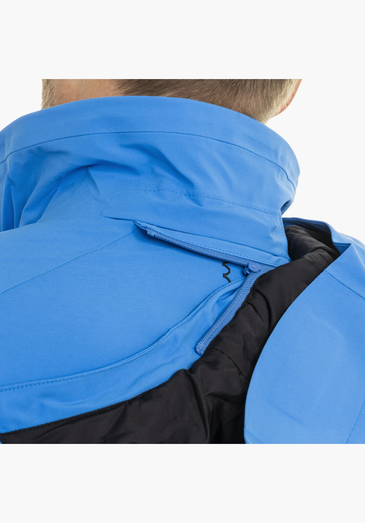 Jacket Style Pontre MEN showing the blue collar area with integrated zipper and the subtle Schöffel logo in a close-up against a white background.