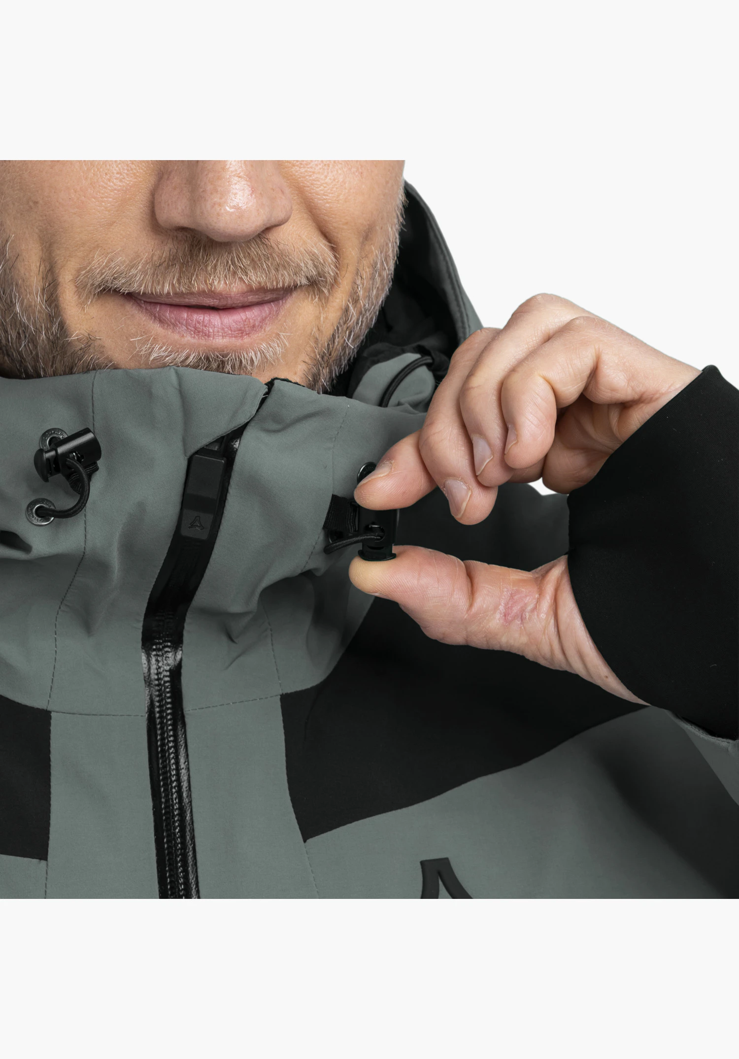 Jacket Style Levivo MEN in grey focusing on the high collar, adjustable drawcord and black zipper, close-up against a white background.