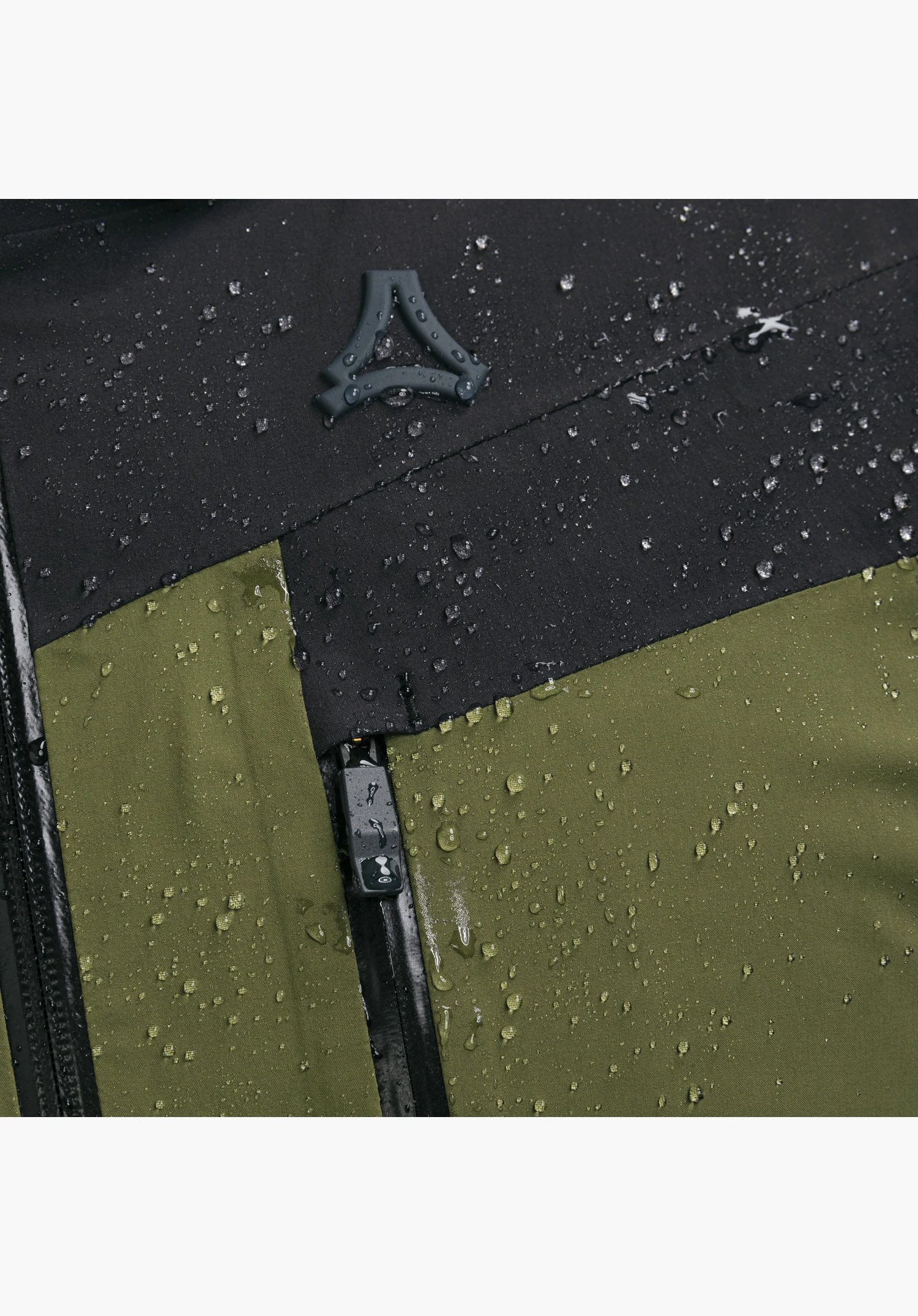 Jacket Style Safuna MEN showing water-repellent green and black material, sealed zippers, water droplets, and a raised Schöffel logo in a close-up against a white or neutral background.