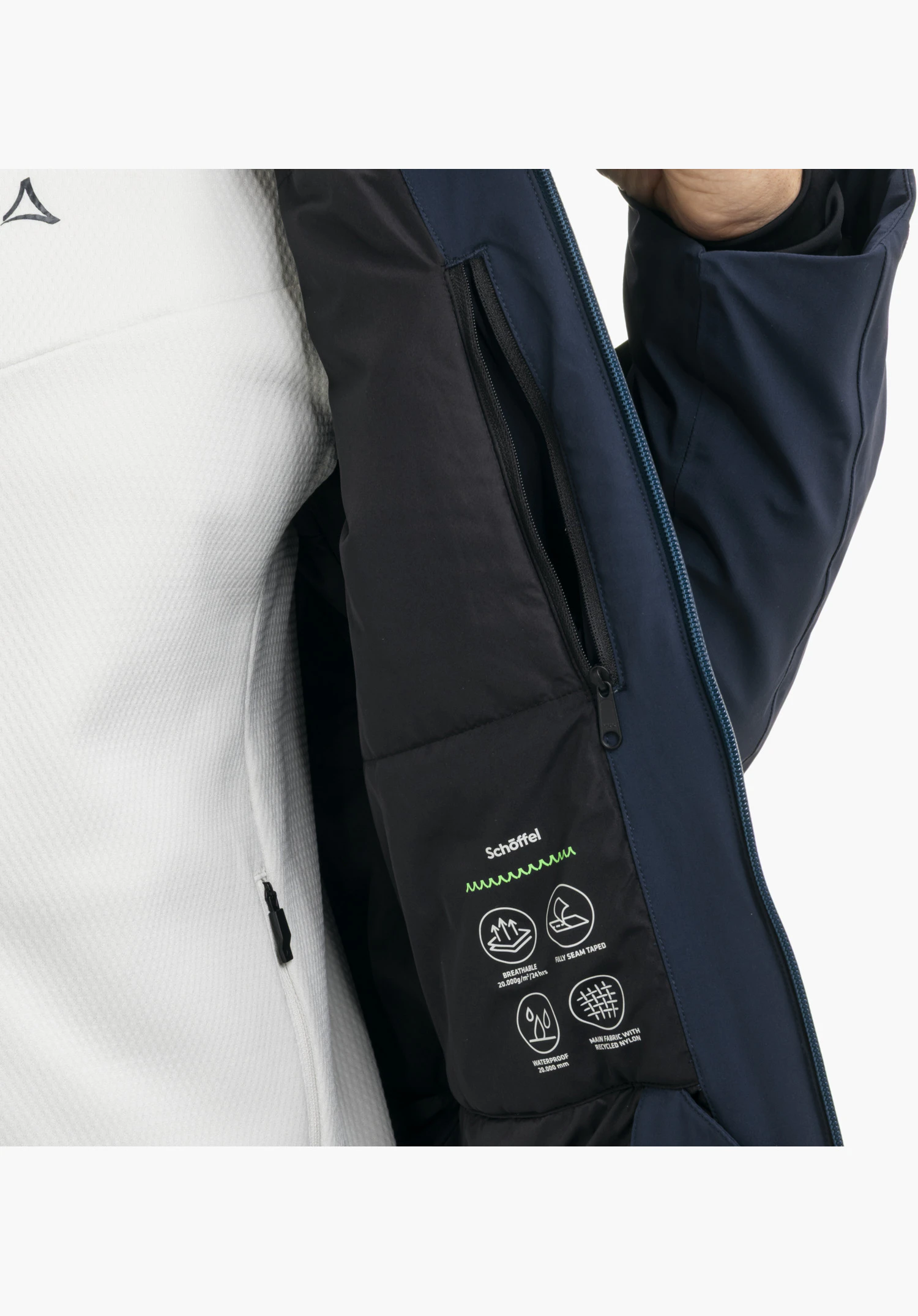 Jacket Style Safuna MEN showing a view of the blue inner side featuring a black zipped inner pocket, the Schöffel lettering and functional icons, close-up against a white background.