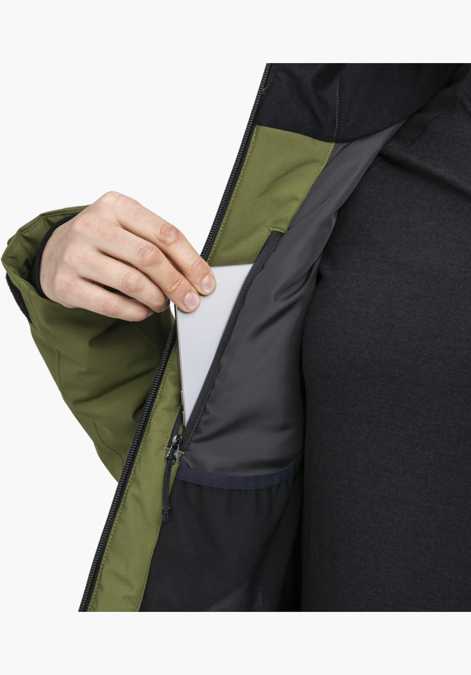 Jacket Style Trifex WMN en vert avec une poche intérieure zippée pratique dans laquelle un smartphone est inséré, gros plan sur fond blanc.