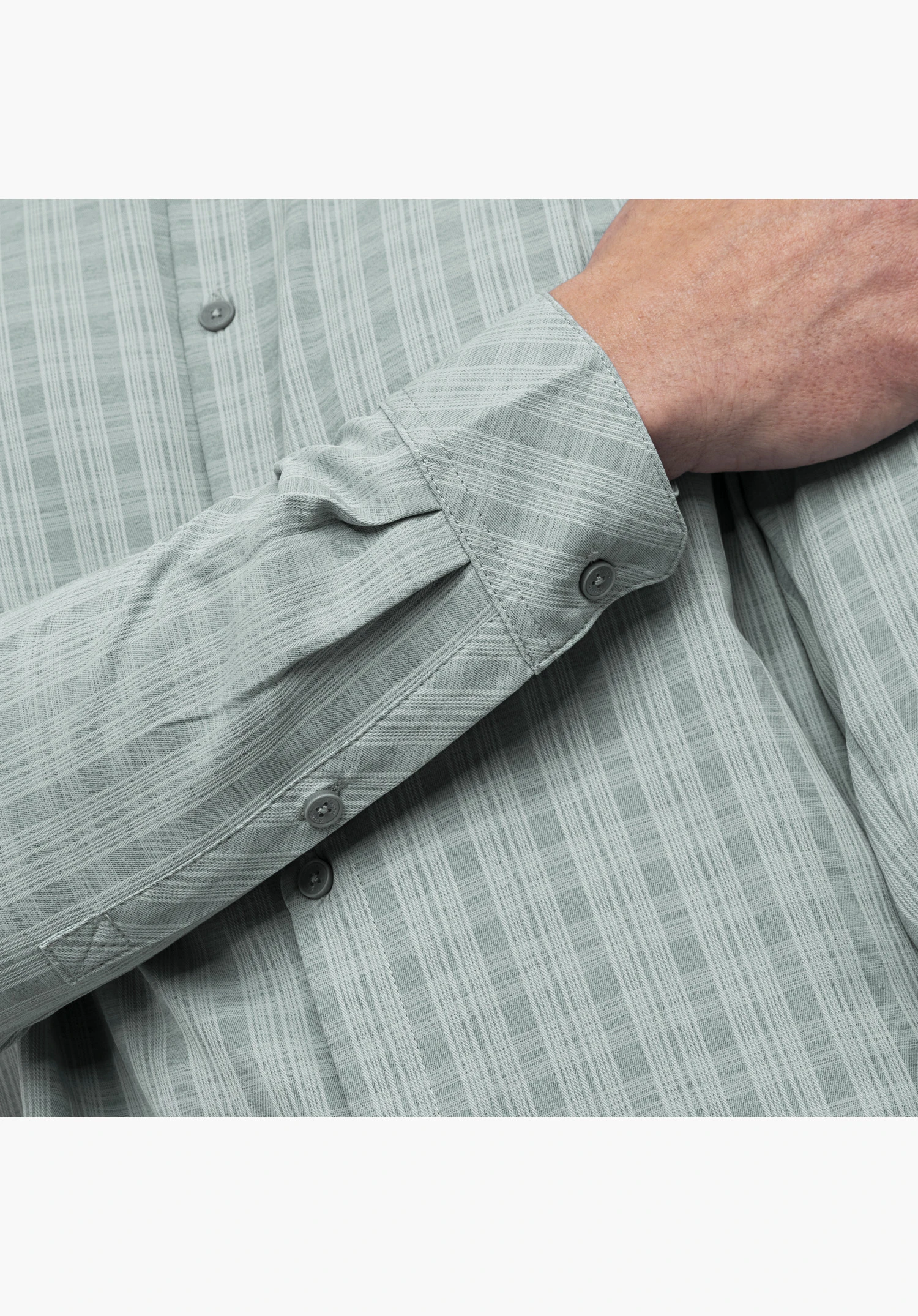 Shirt Style Energio MEN showing a close-up of the grey textured fabric, cuff, and button placket on the sleeve against a white background.