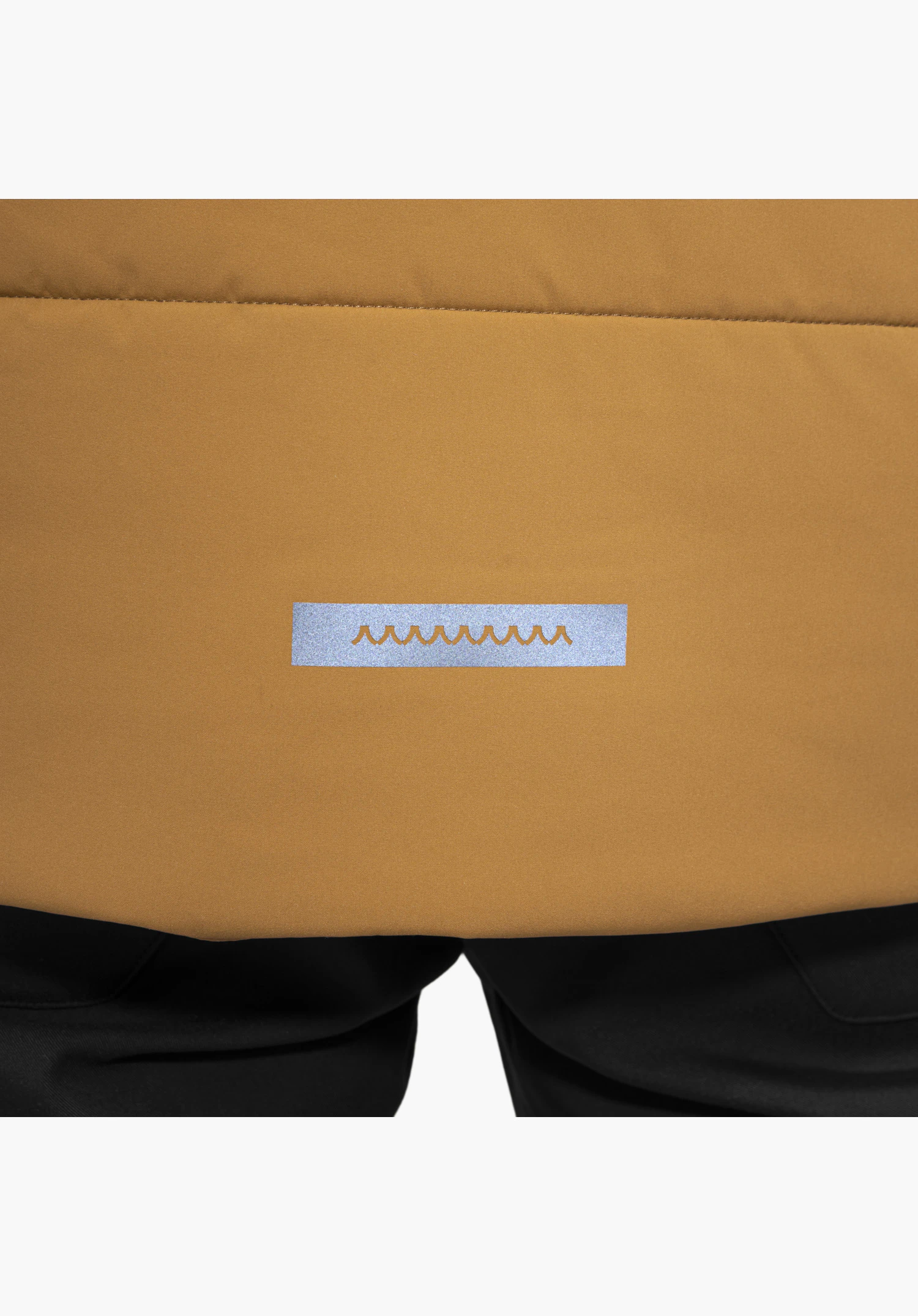 Ins Jkt Style Purga MEN shows a reflective detail featuring the Schöffel logo on the brown fabric in a close-up against a white background.