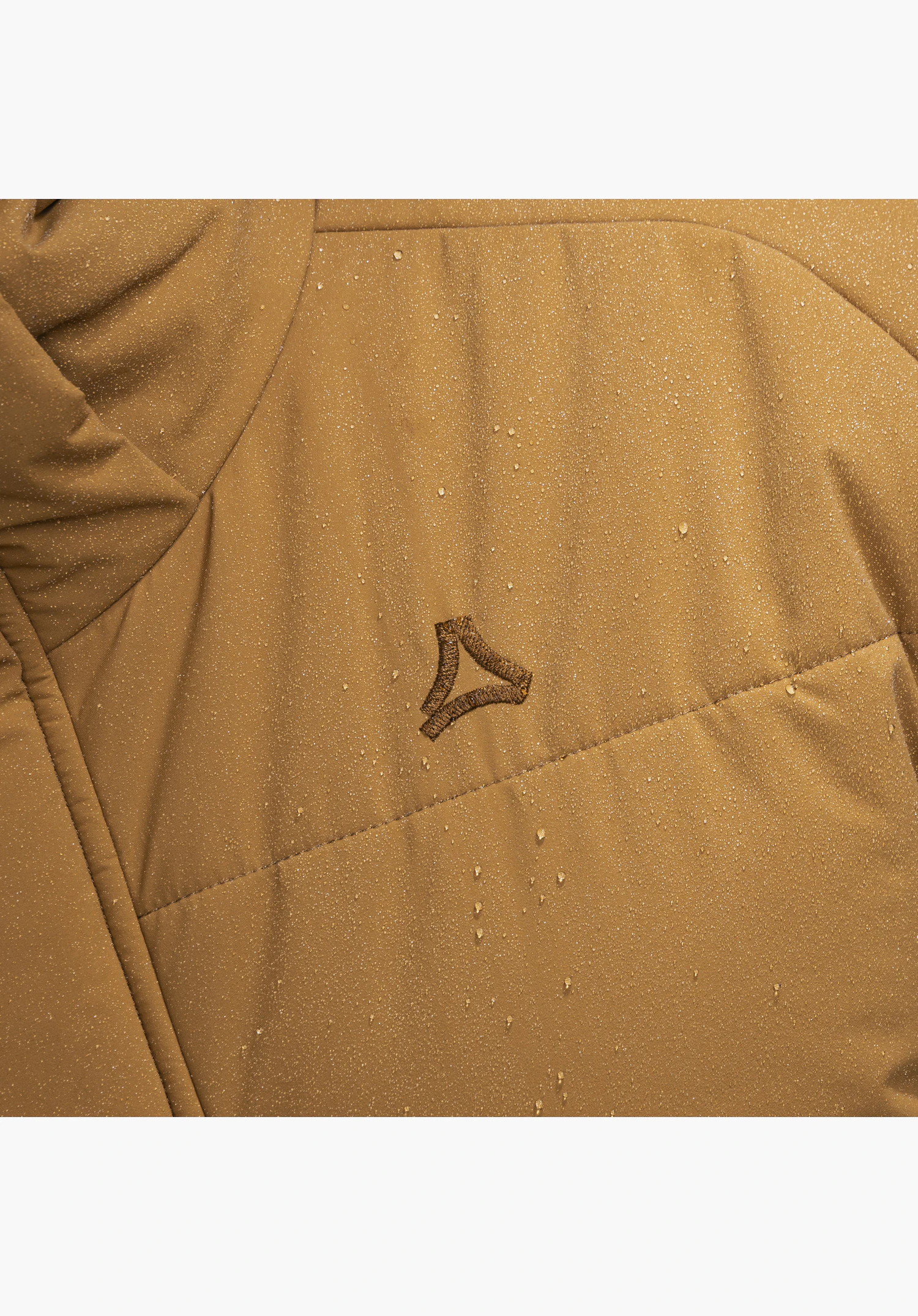 Ins Jkt Style Purga MEN featuring the embroidered Schöffel logo on the brown, water-repellent material structure with water droplets in a close-up against a neutral background.