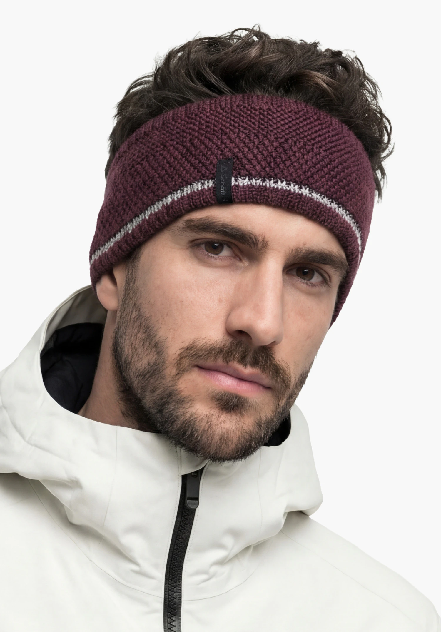 Headband Style Wildkar ALL in purple with Schöffel lettering, worn by a male model in a back view standing upright against a white background. (AI-generated)