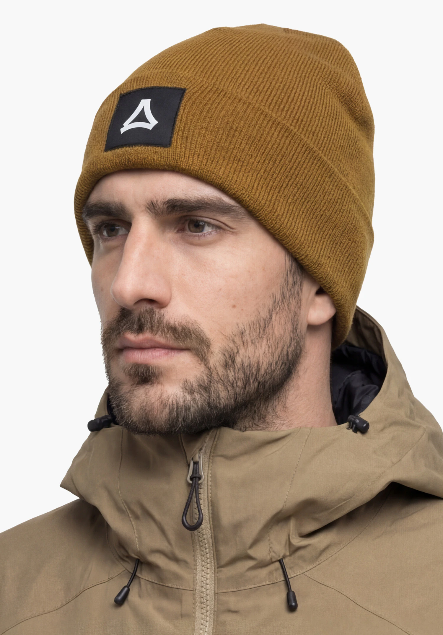 Hat Style Lodos ALL in brown, featuring the Schöffel logo on the front, worn by a male model standing upright in a back view against a white background. (AI-generated)