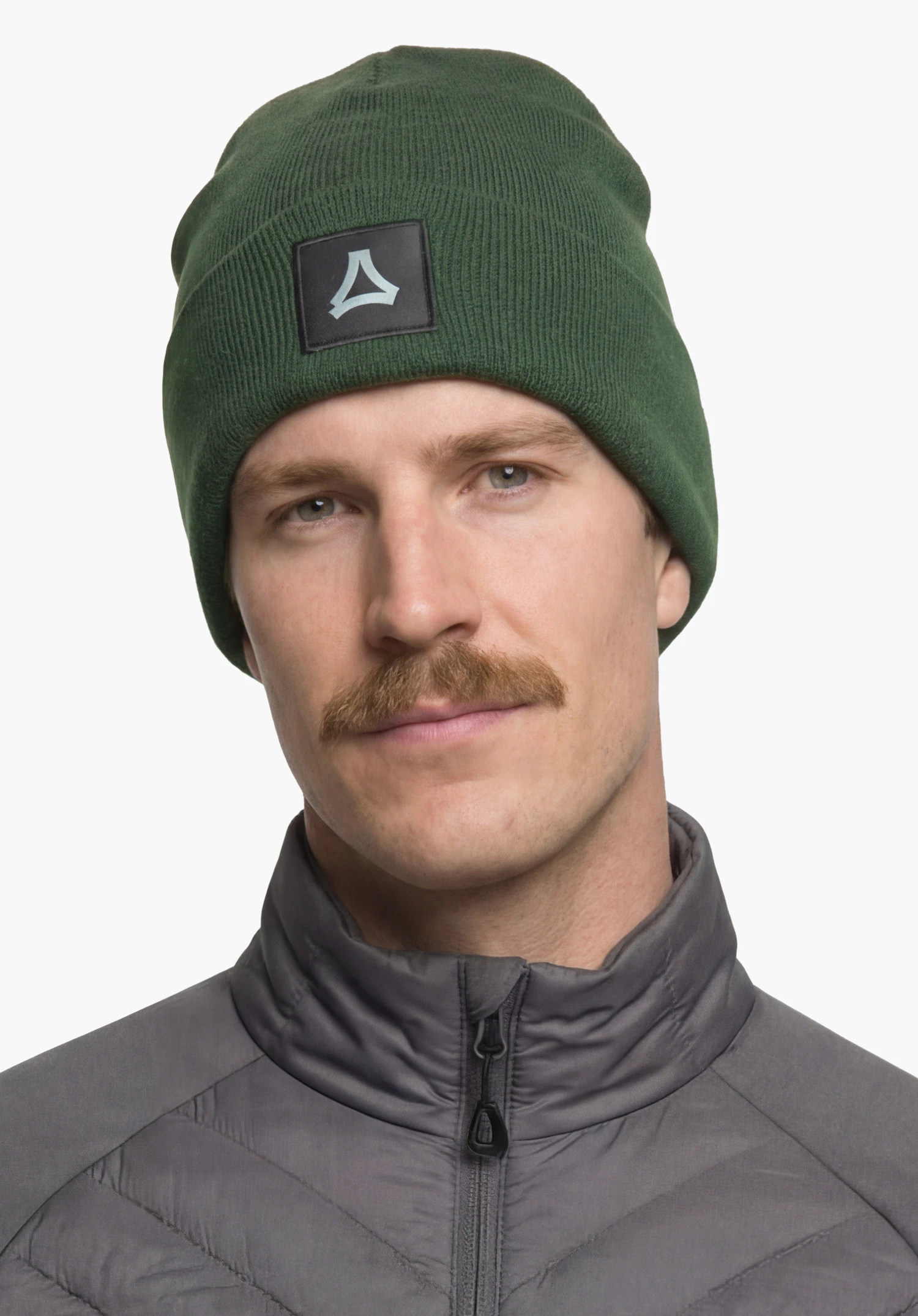 Hat Style Lodos ALL in green featuring a visible Schöffel logo on the patch, worn by a male model in a back view standing upright against a white background. (AI-generated)