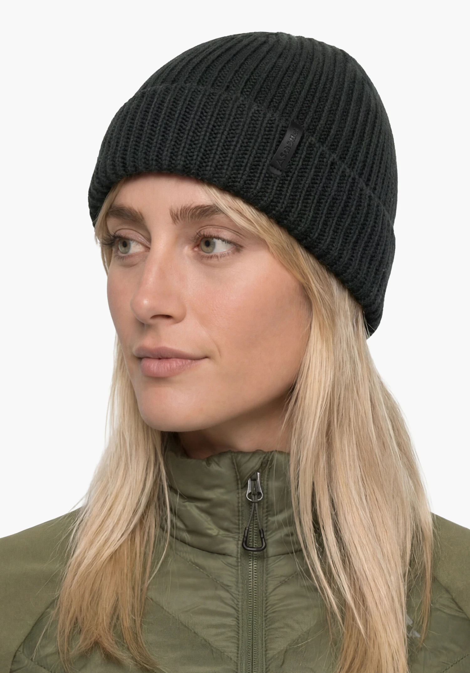 Hat Style Noxley ALL in black with Schöffel lettering, worn by a female model standing upright in a back view against a white background. (AI-generated)