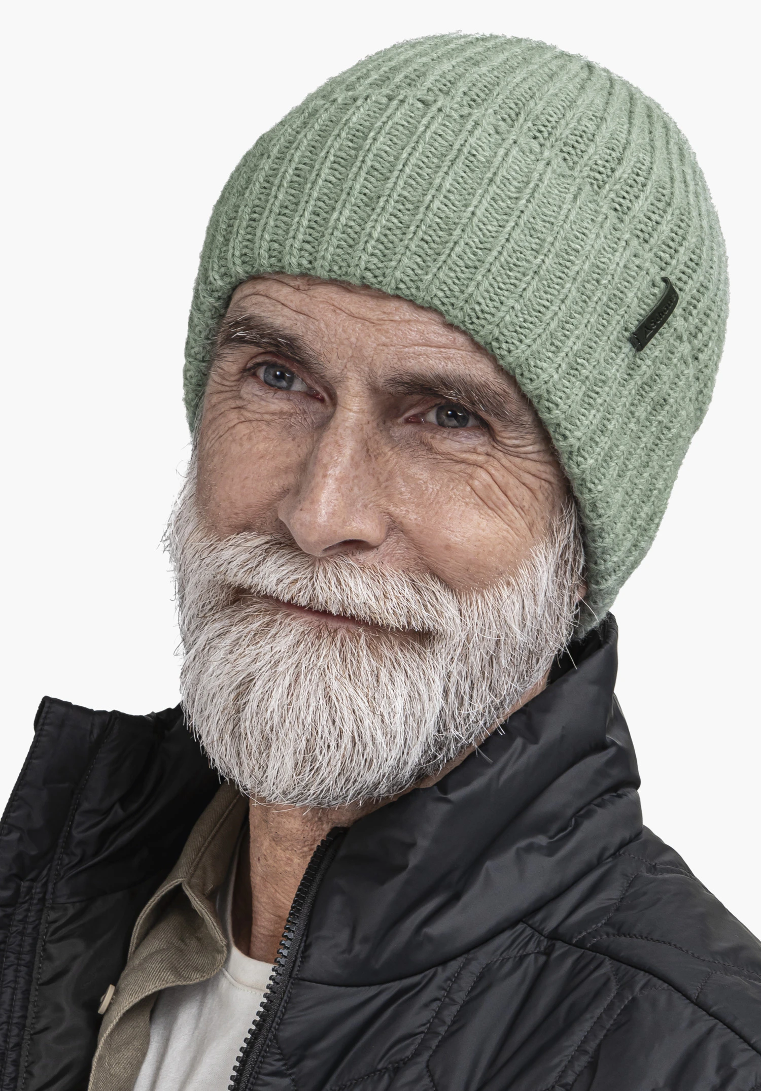 Knitted Hat Medford in green with Schöffel lettering, worn by a male model with a white beard in an upright standing position in a rear view against a white background. (AI-generated)