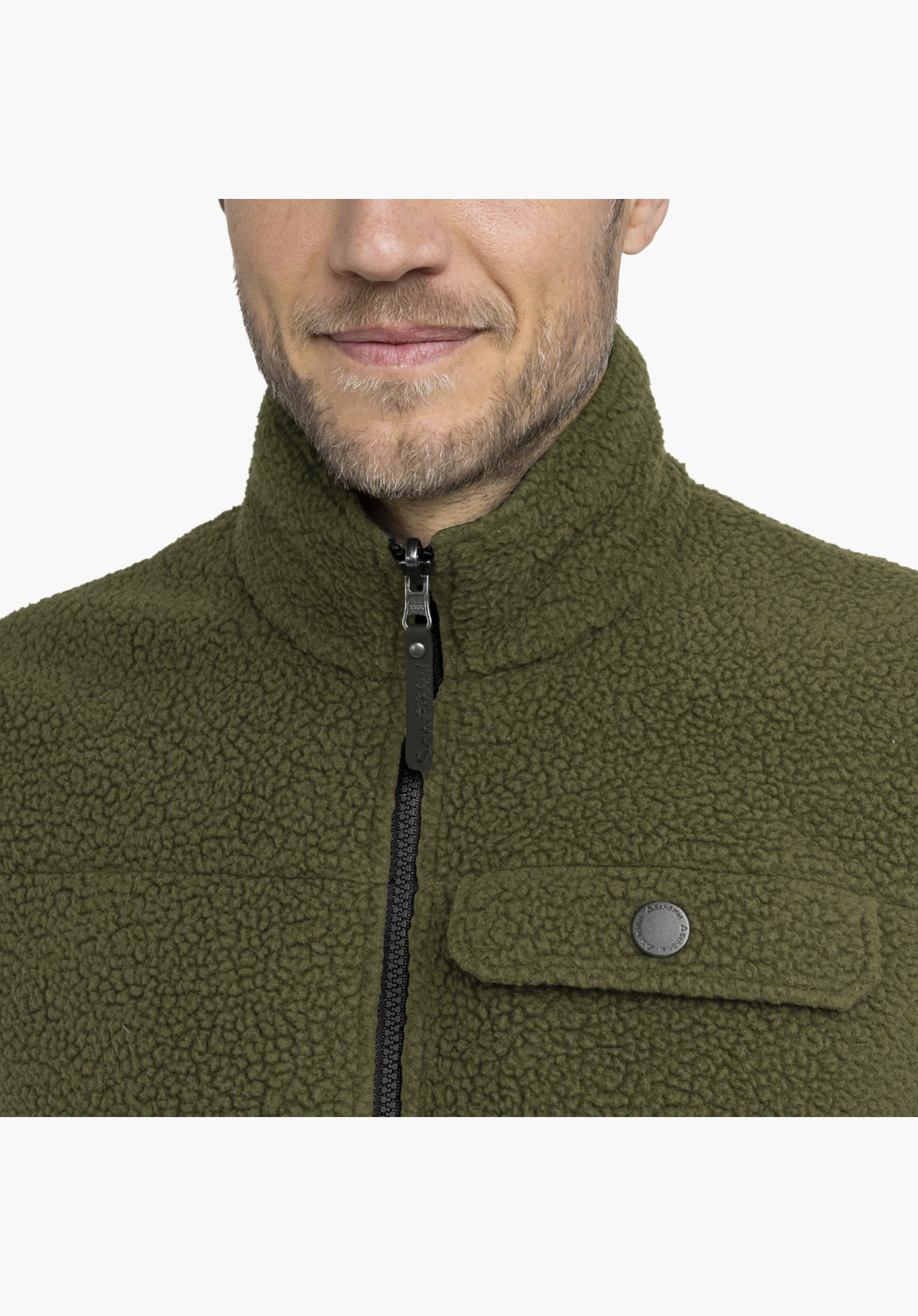 Vest Style Purga MEN in green featuring a high collar, zipper with Schöffel lettering on the puller, and a chest pocket with a snap button featuring the Schöffel logo close-up against a neutral background.